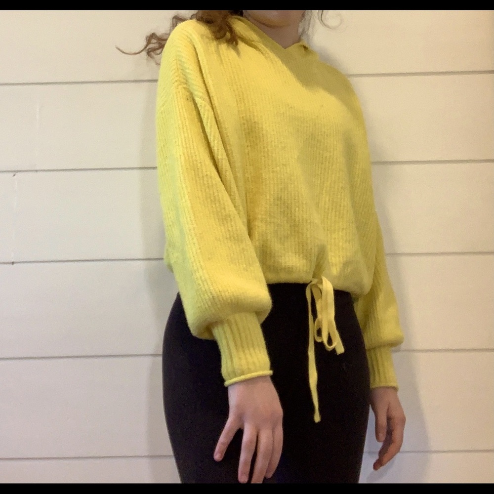yellow sweater in cropped hoodie style